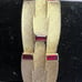 Signed vintage 1950s gold tone LISNER bracelet w/ red faux rubies 7” by 3/4”