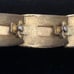 Signed vintage 1950s gold tone LISNER bracelet w/ red faux rubies 7” by 3/4”