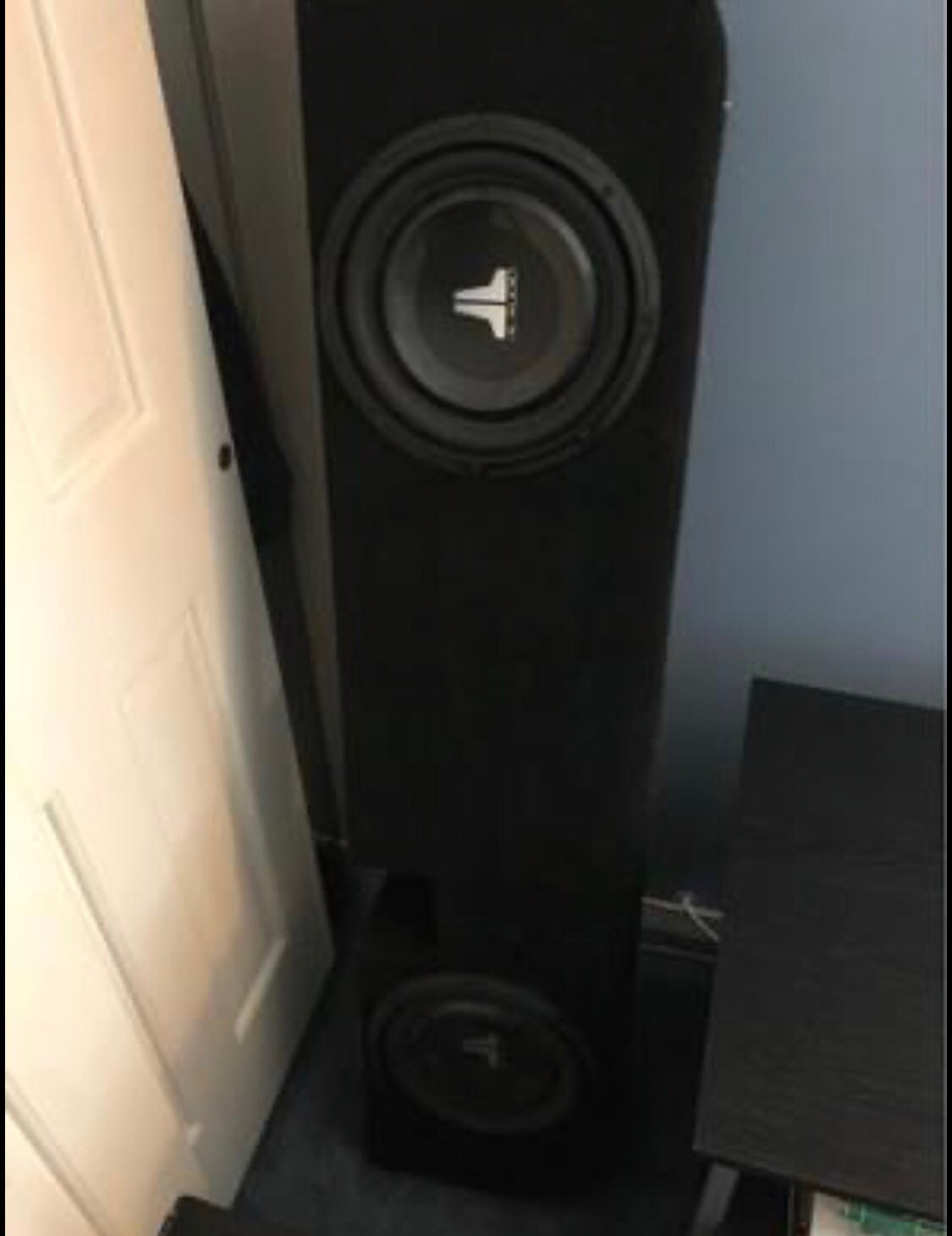 JL audio subwoofers and an amp