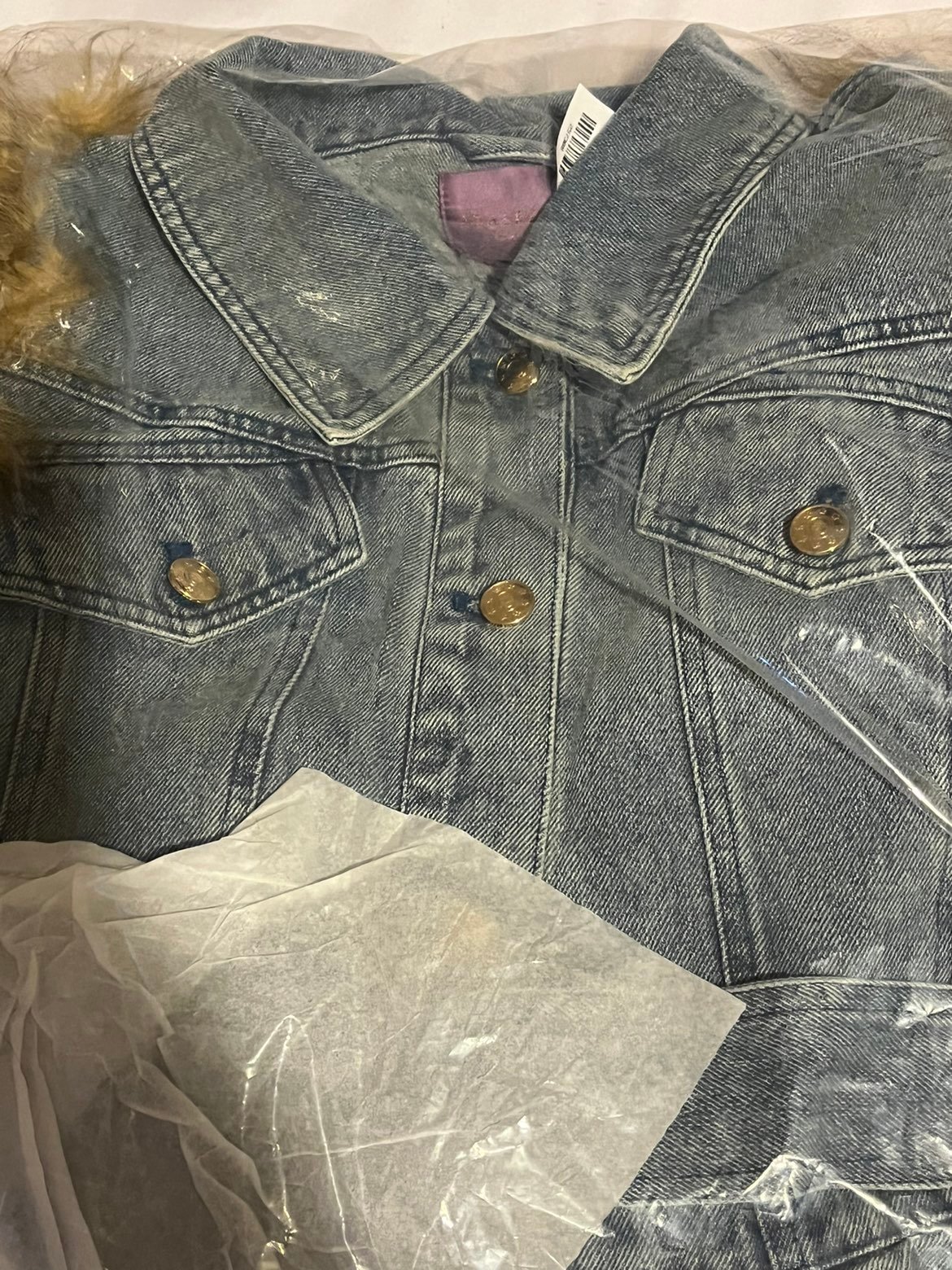 jean jacket with Fur on The sleeves extra large brand-new with the tags looks go