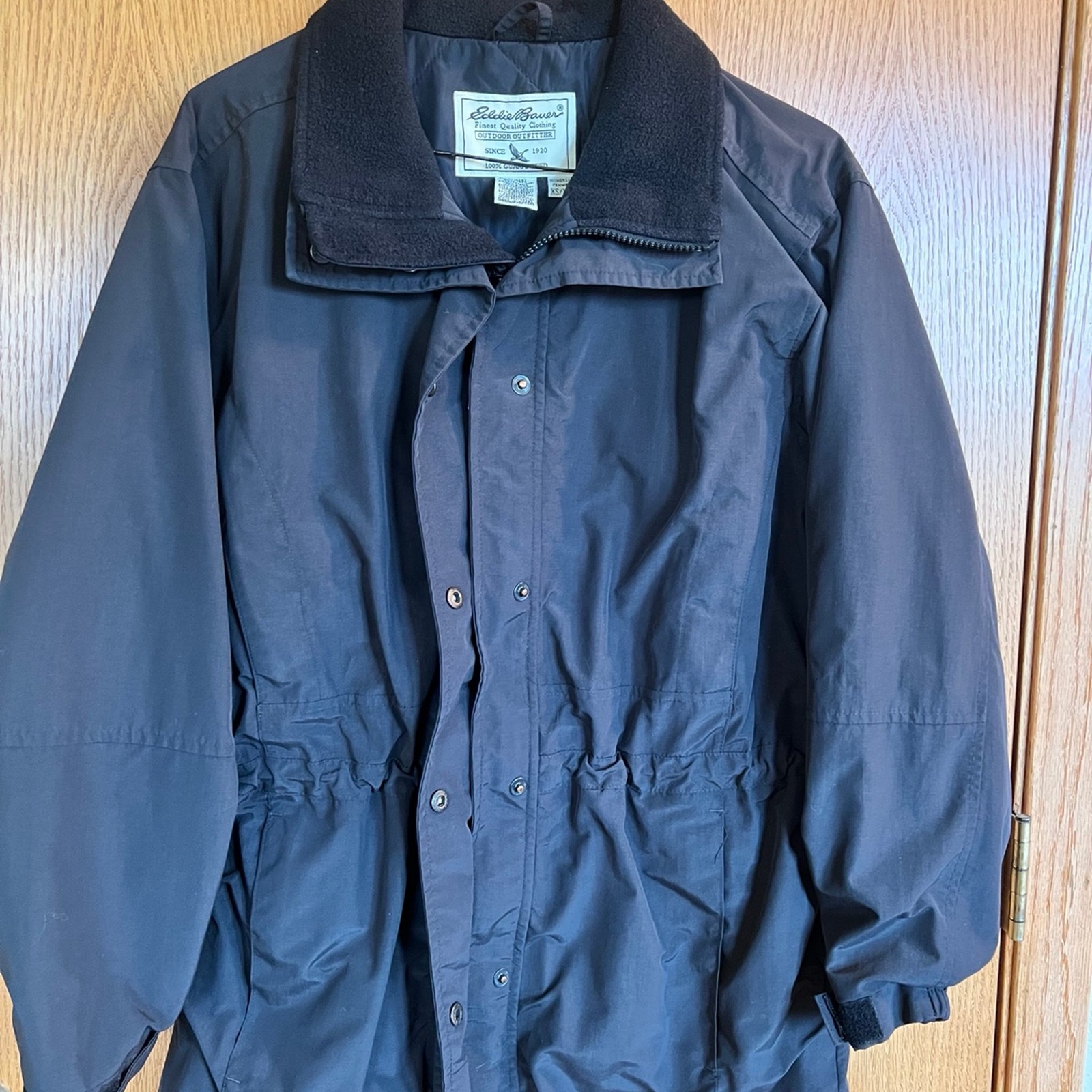 Eddie Bauer coat, women's size XS, black drawstring waist.