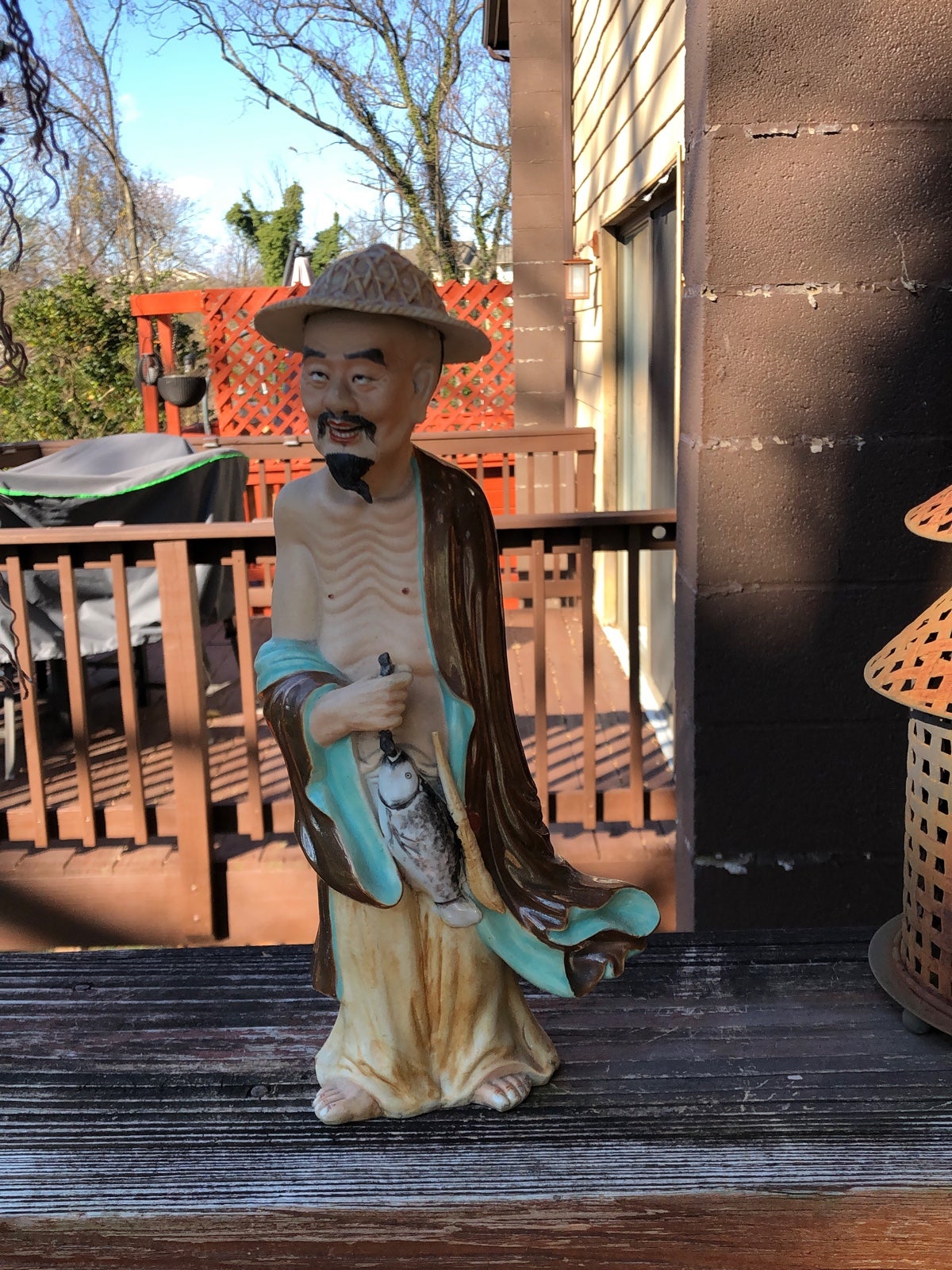 Asian porcelain figurine of bearded fisherman