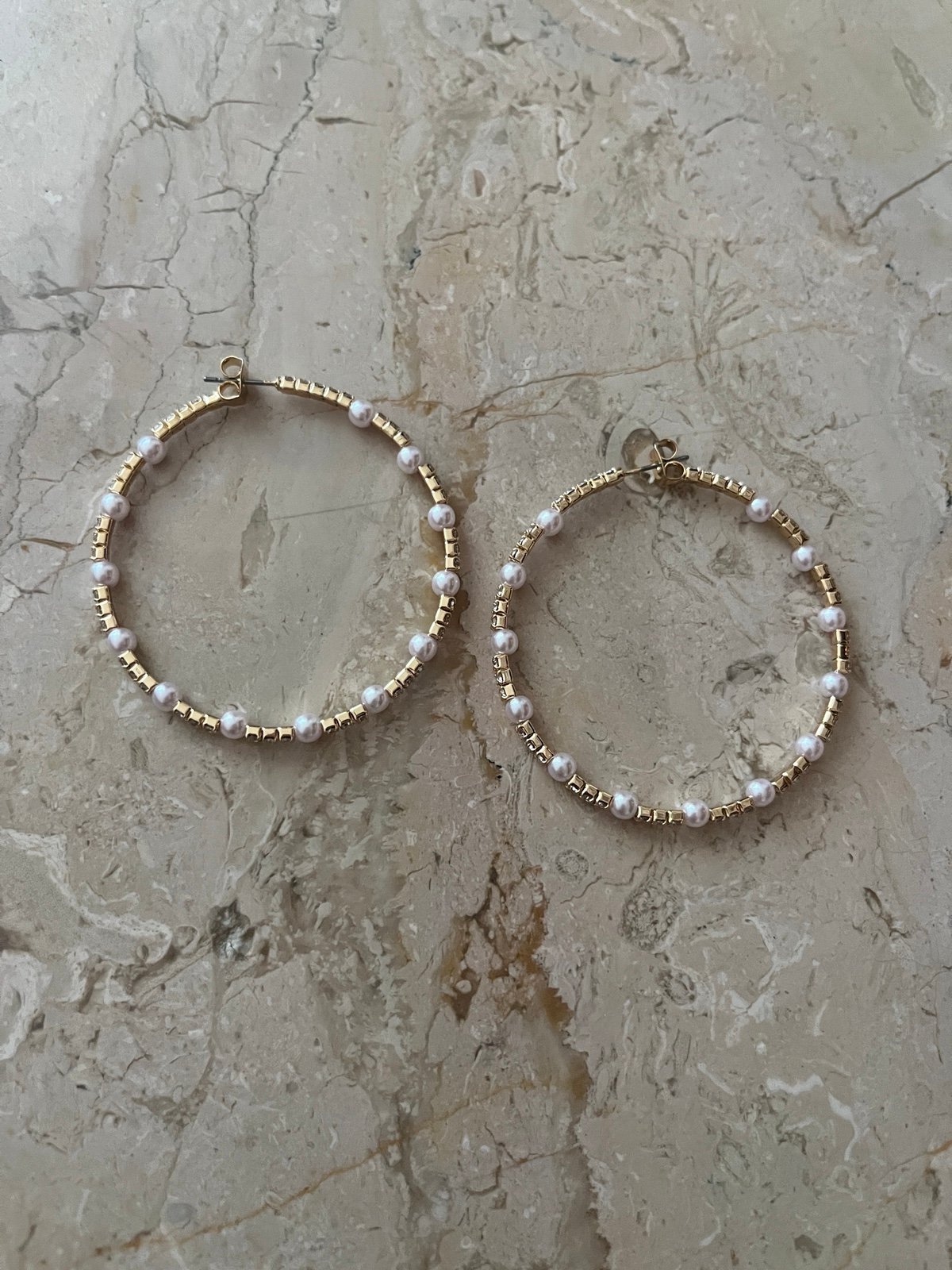 Gold pearl hoop earrings revolve