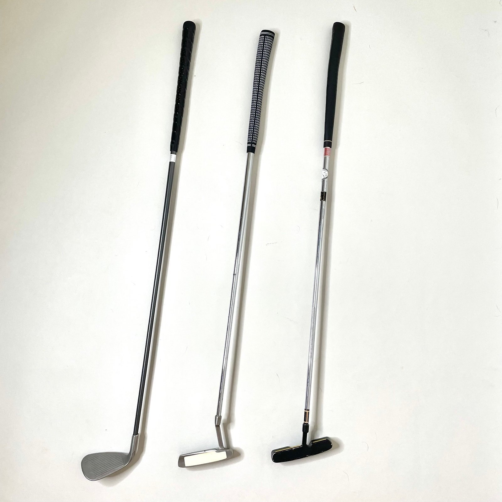 Bundle of 3 clubs — 2 putters and sand wedge. Nice deal