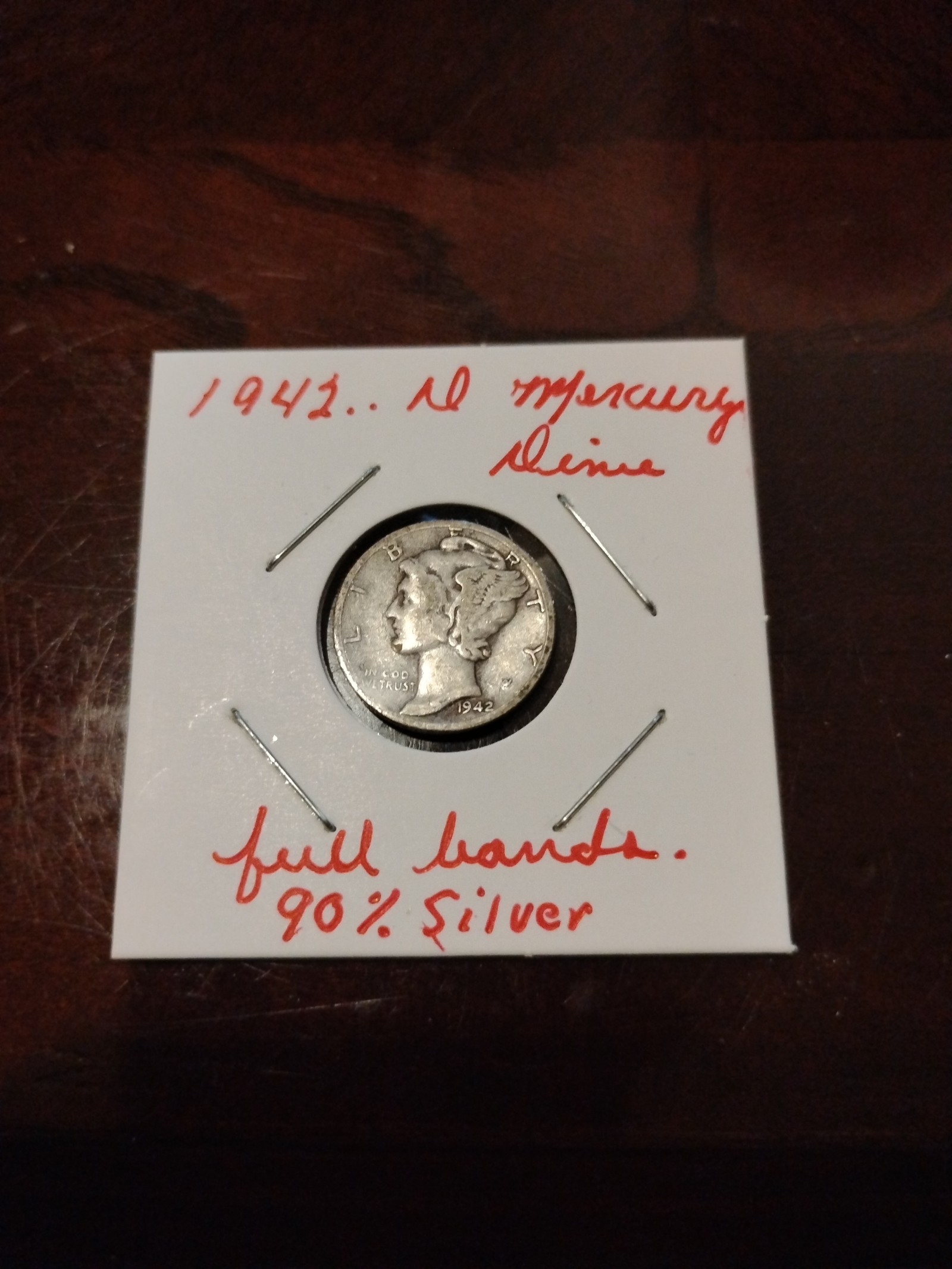 Silver 1942 d Mercury dime with bands