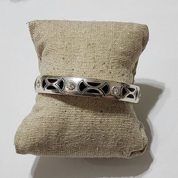 Brighton retired black enamel and accepted silver plated hinged bracelet