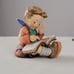 Hummel figurine boy thoughtful