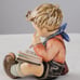 Hummel figurine boy thoughtful