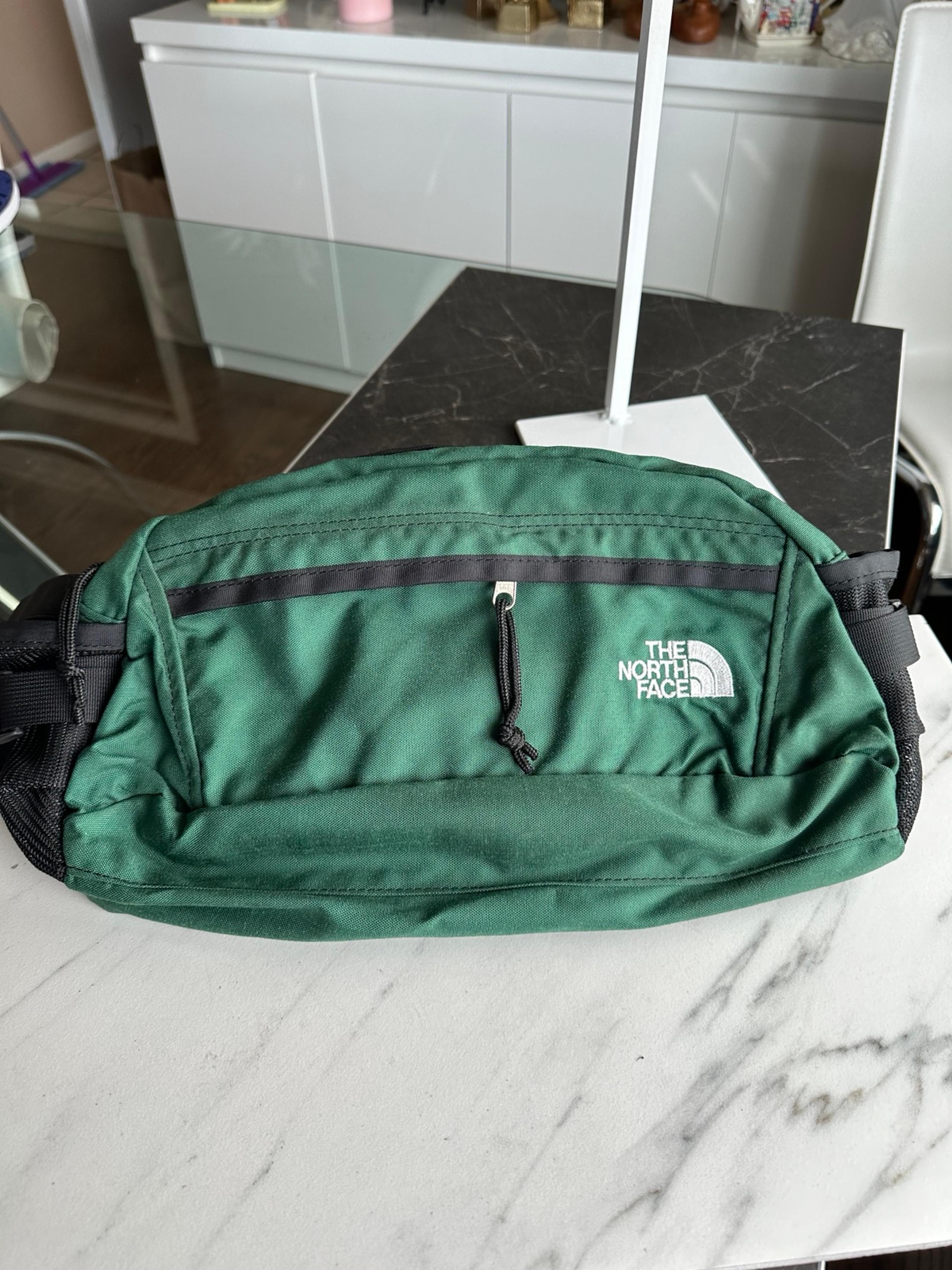 The North Face green hiking waist bag for men