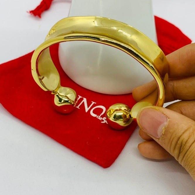 UNO DE 50 ZEN BRACELET Rigid Gold plated bracelet with two balls