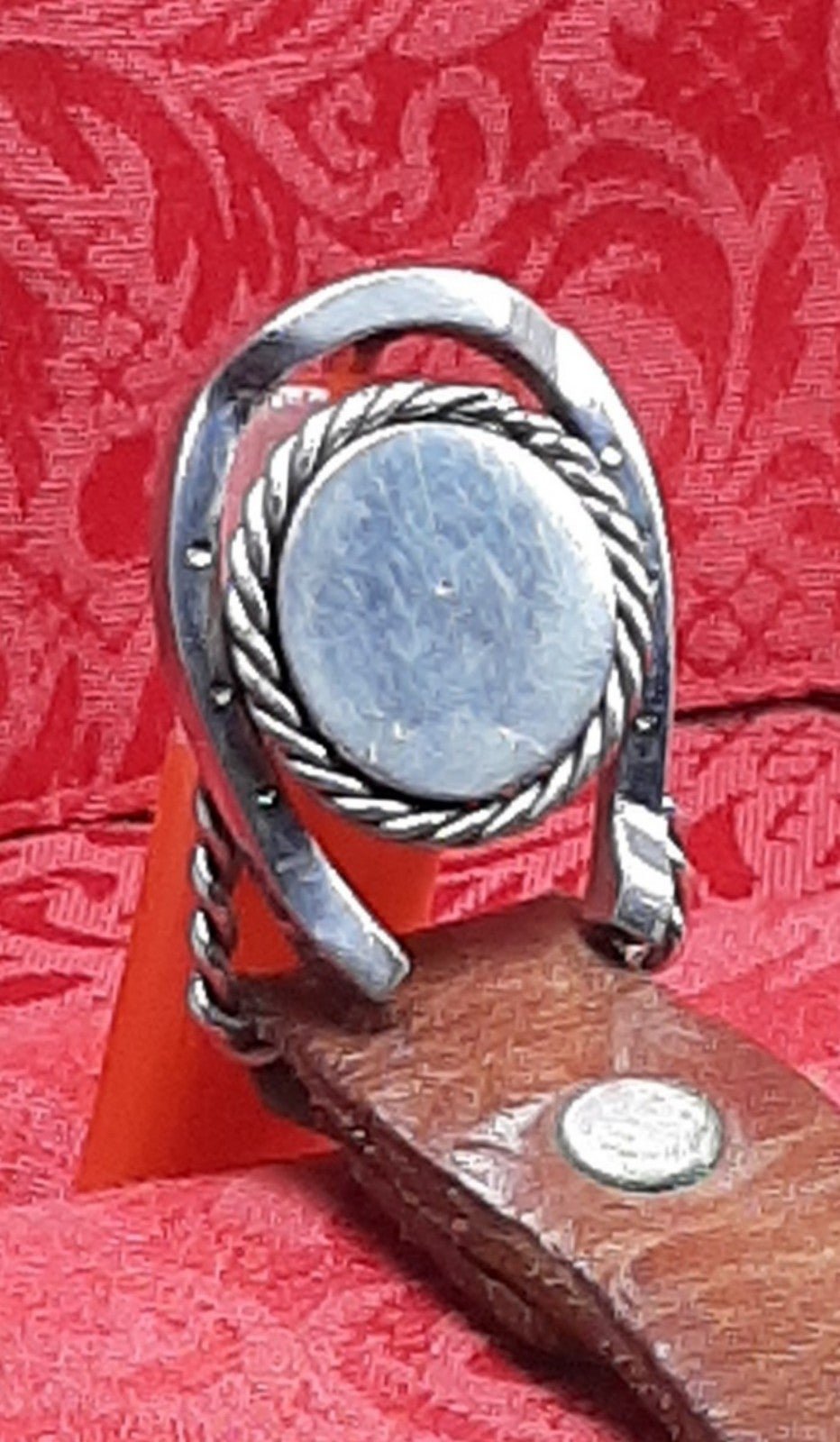 Vintage Silver Horseshoe Around Coin Peg Belt Buckle on a Man's Leather Belt