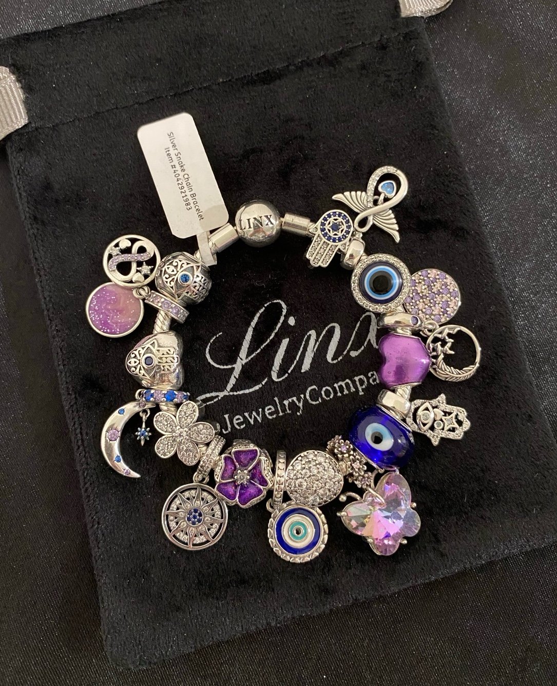 Linx Silver Bracelet with Purple and Blue Hamsa Hand and Evil Eye Themed Charms