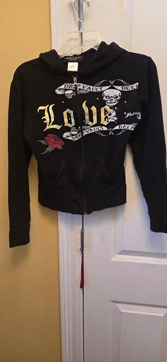 Romeo & Juliet Couture black hoodie with elegant gold accents