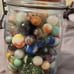 Vintage marble collection in a jar
