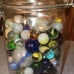 Vintage marble collection in a jar