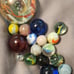 Vintage marble collection in a jar