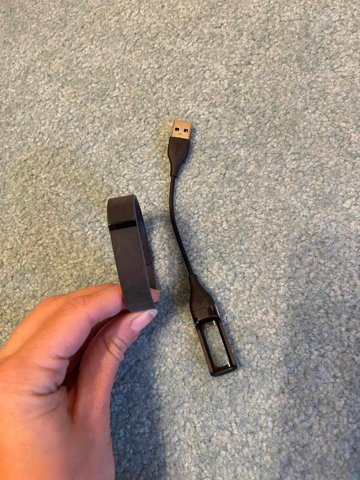 Black Fitbit flex fitness trackers with Charger