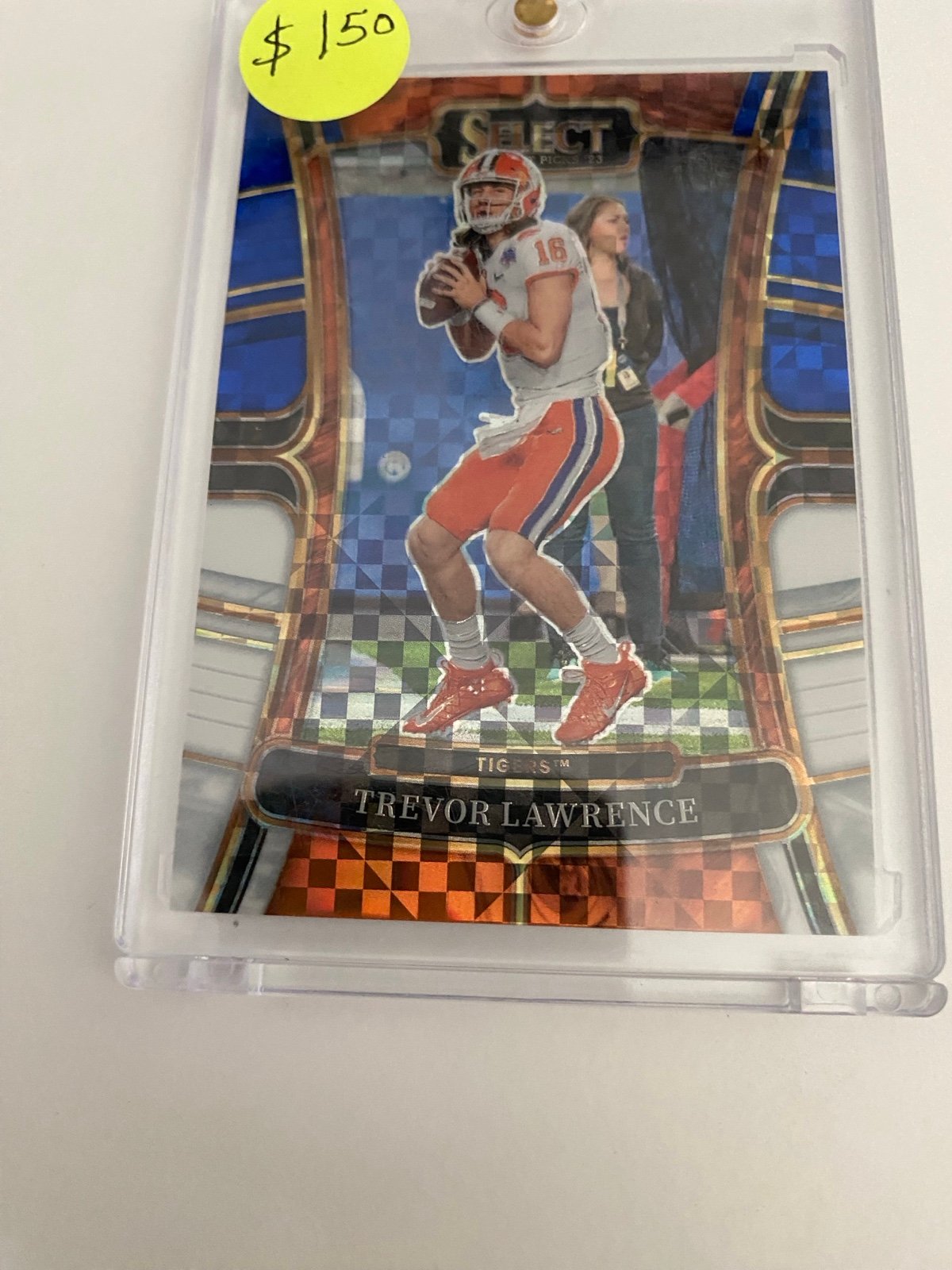 Trevor Lawrence select orange and blue football card 22/100