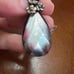 Sterling Black Mother of Pearl Pendant with Carved Flower Details
