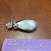 Sterling Black Mother of Pearl Pendant with Carved Flower Details