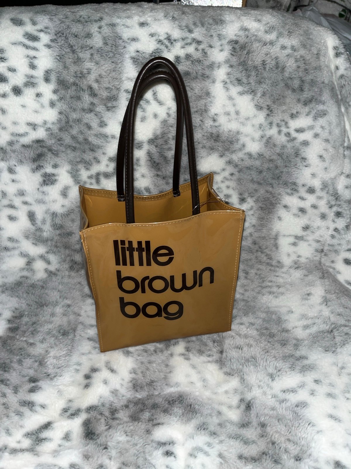 Nordstrom’s little brown vinyl bag