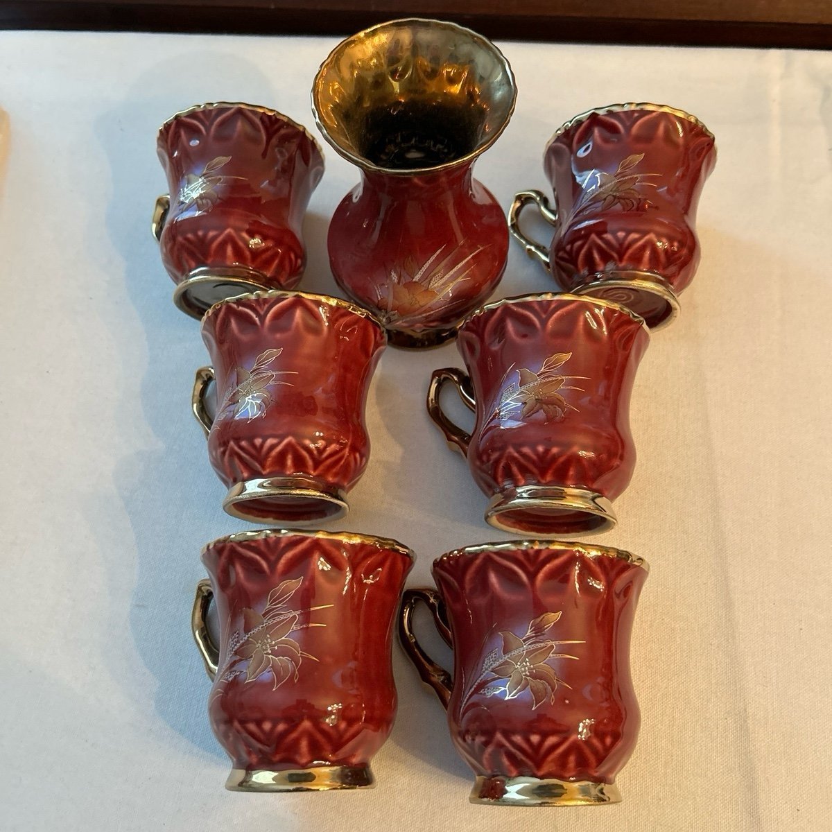 Coffee cups six burgundy and gold plated porcelain coffee cups and vase
