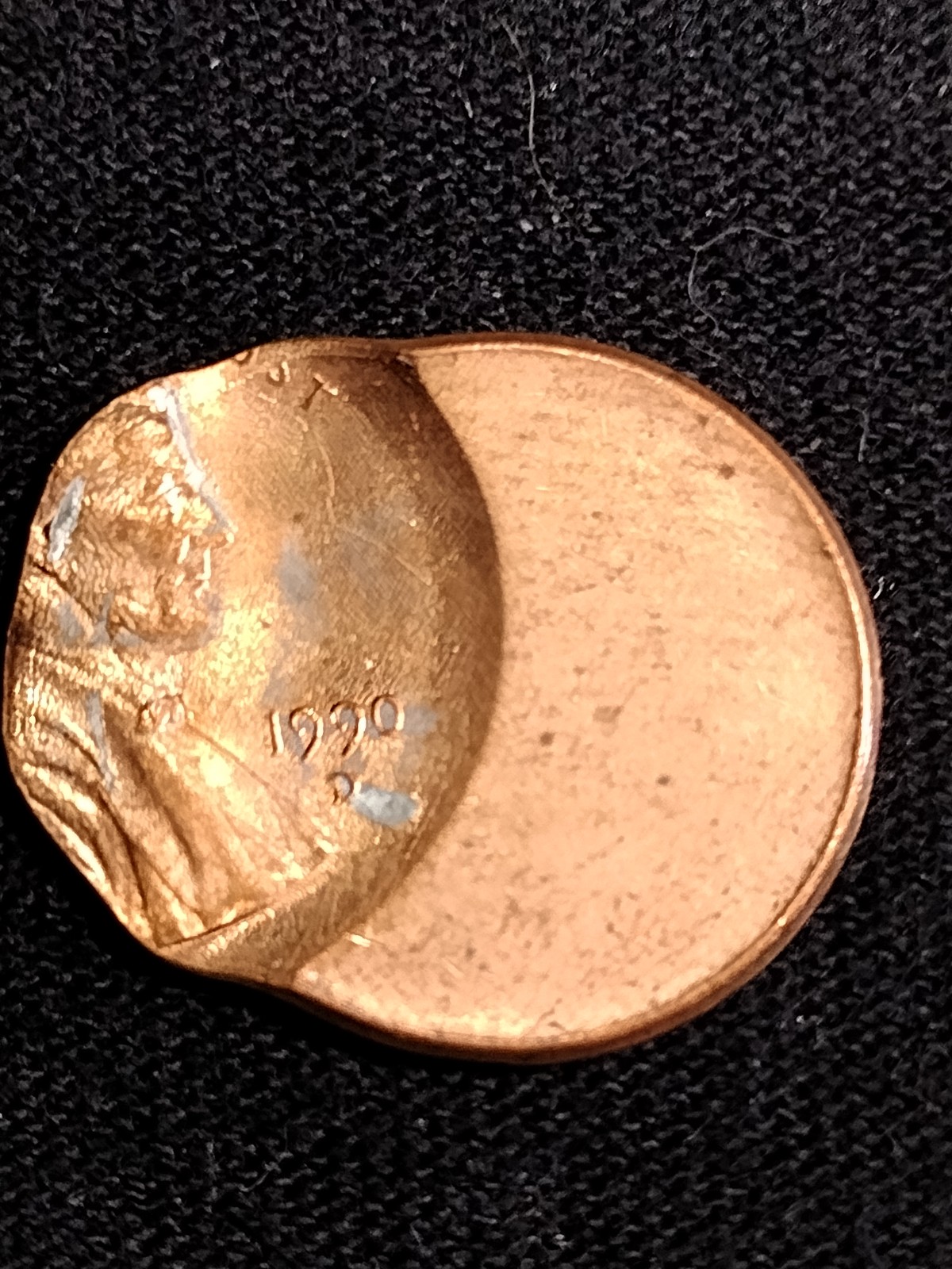 Error coin 1990...D..minted USA.penny Error.(struck off center)