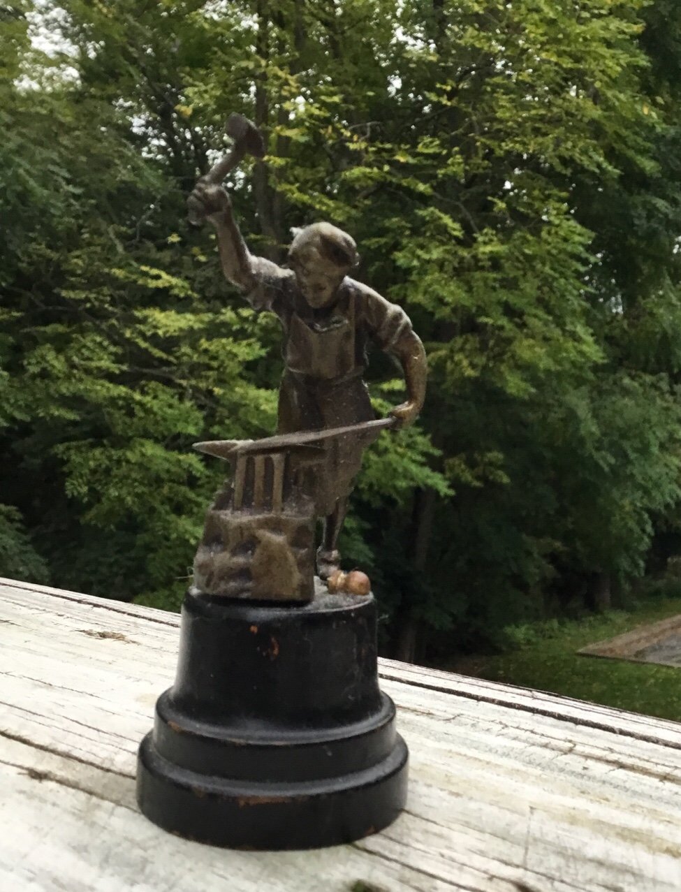 Vintage cast metal or bronze farrier at work