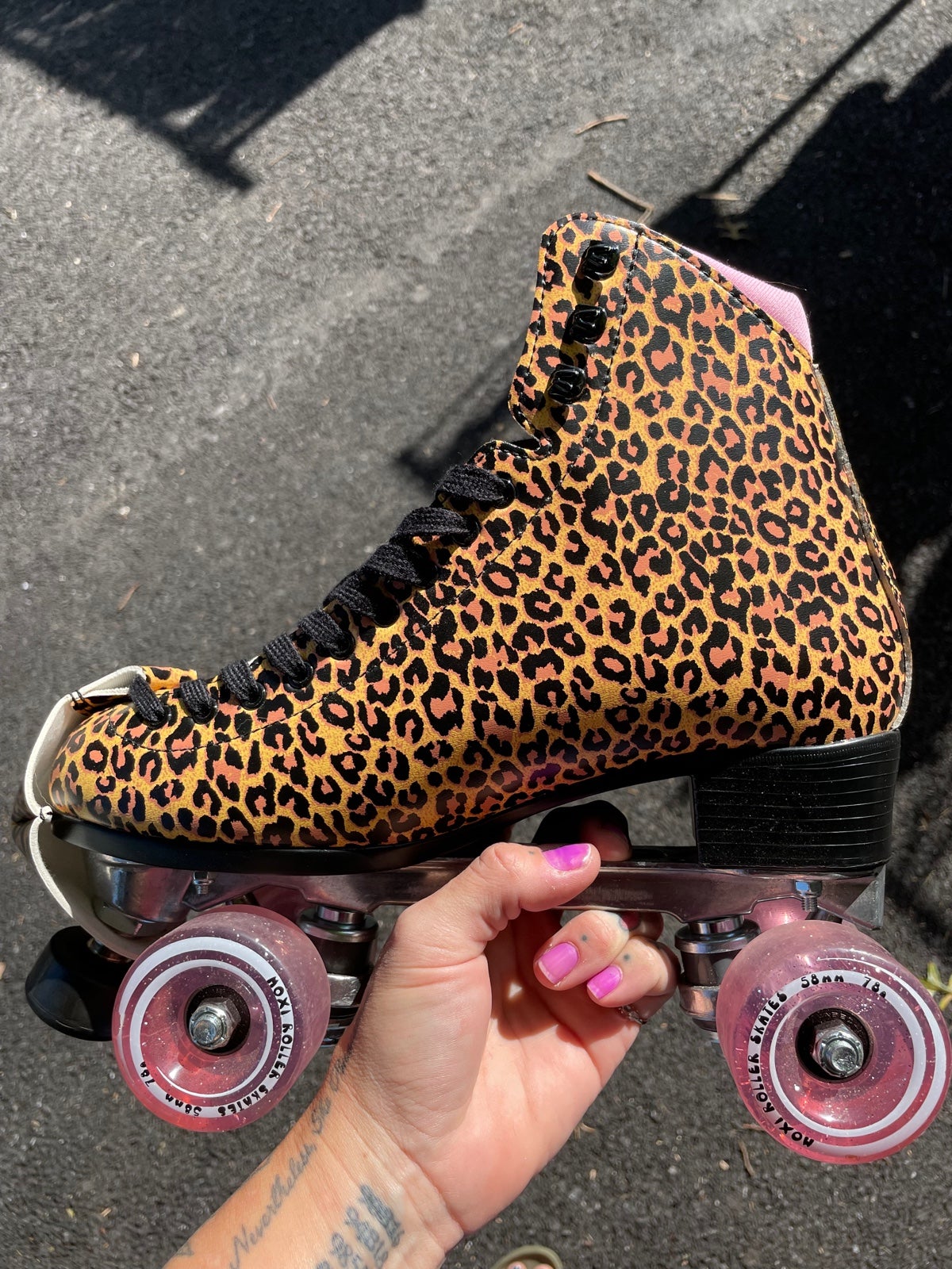 Moxi leopard roller skates and pads