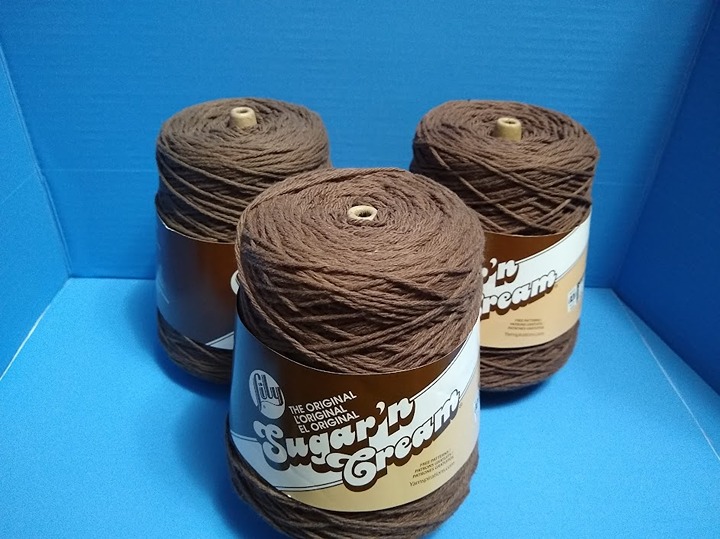 Three cones of Warm Brown Lily Sugar 'n Cream