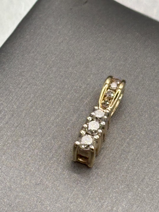 A Beautiful Ladies 10 Karat Yellow Gold Three Diamond Pendant