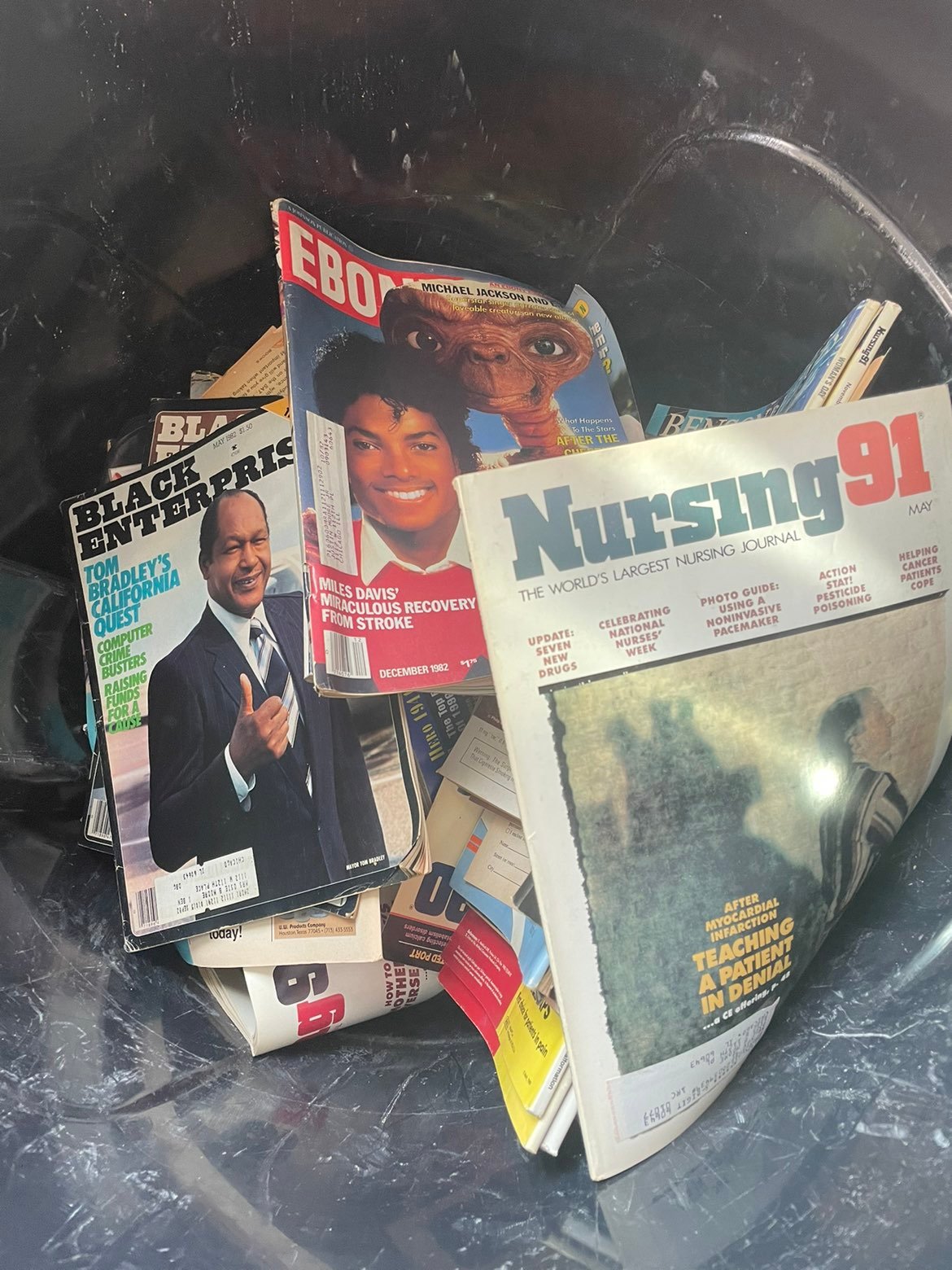 Trash bin full of collectible magazines (ebony,black enterprise , nursing , spor