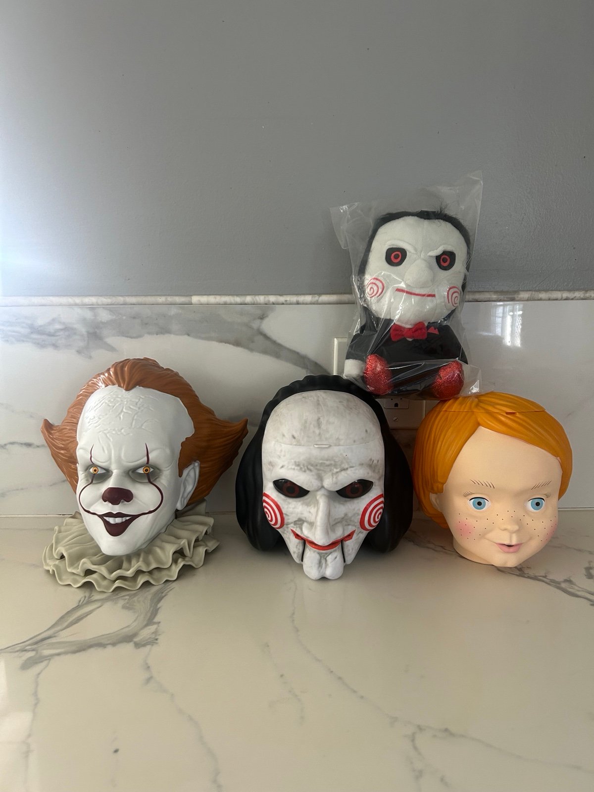 Saw-Pennywise-Chucky popcorn buckets and Saw plush