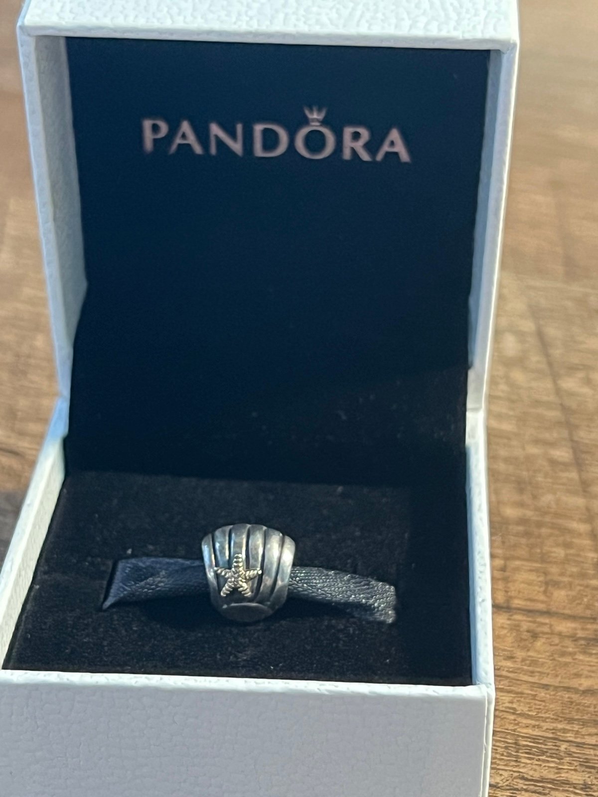 Pandora seashell with gold starfish charm