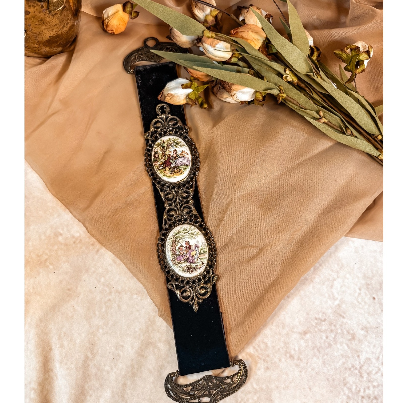 Black velvet wall hanging with courting couple