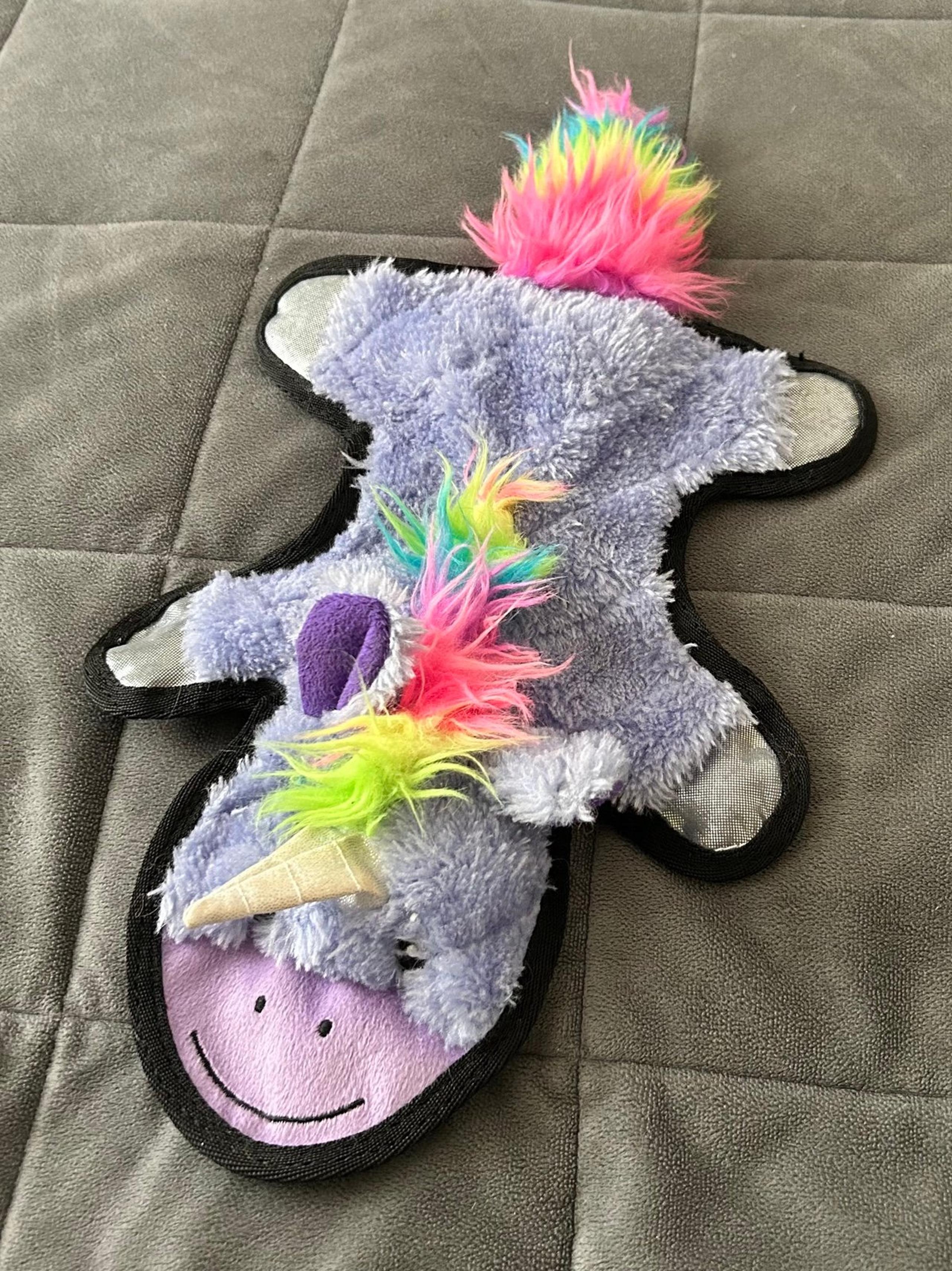 Purple, rainbow unicorn dog toy.