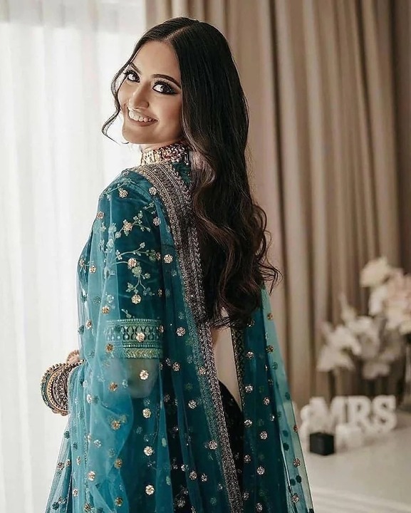 Gorgeous Peacock colored Velvet Lehenga with allover zari embroidery work