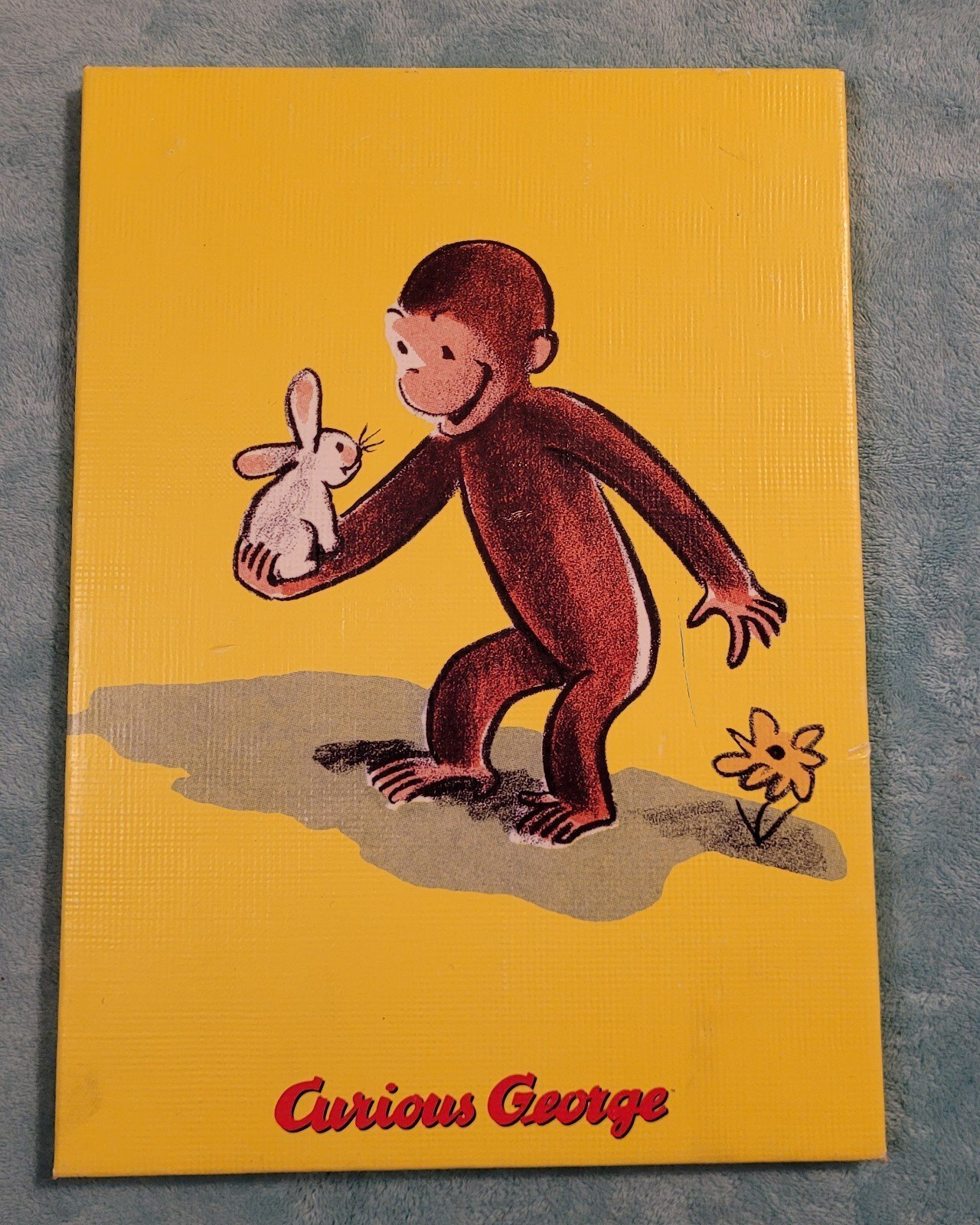 Curious George painting multicolored canvas too cute.