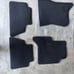First and second row carpeted floor mats jet black