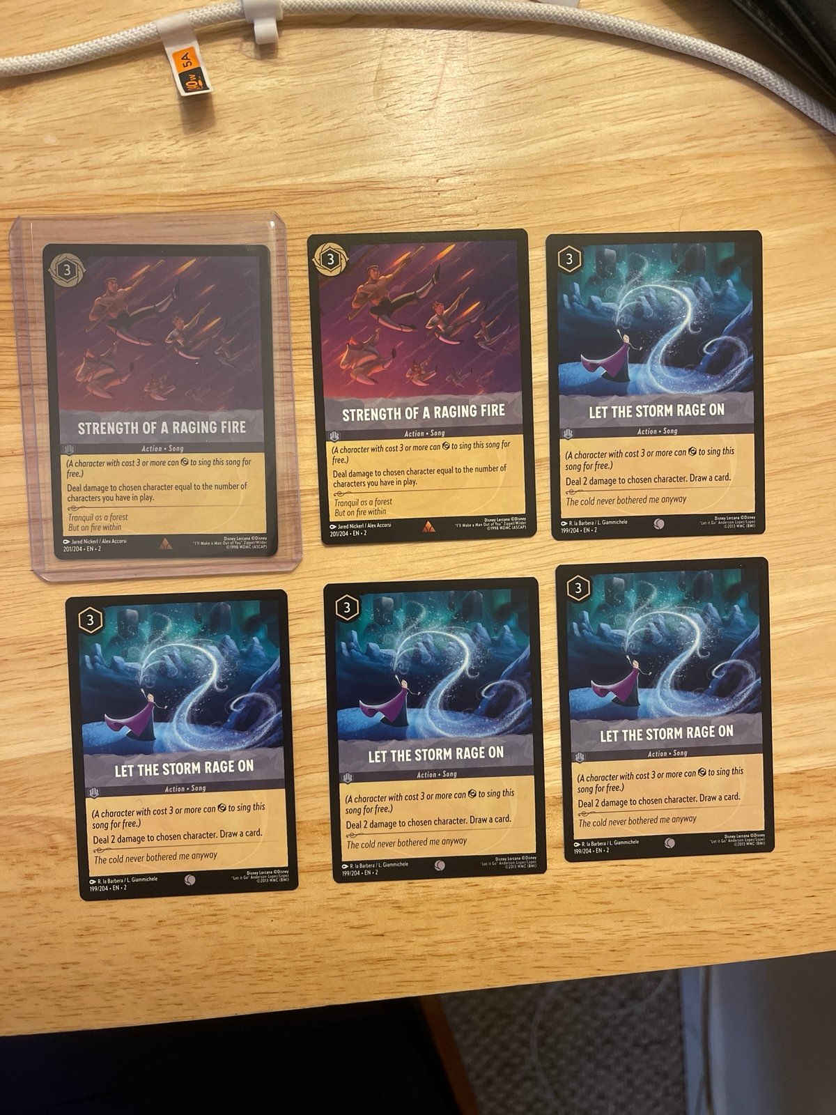 Lorcana 2x Strength of a Raging Fire 1 Cold Foil!
