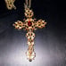 Absolutely beautiful bejeweled gold cross necklace with Ruby in the middle