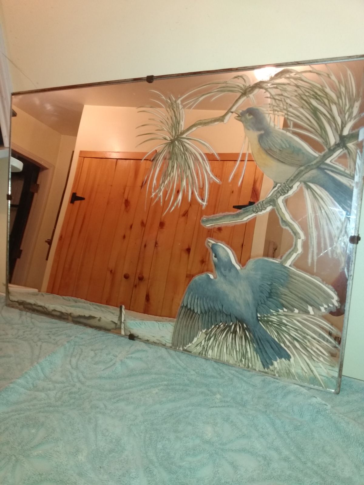 Unmarked vintage reverse painted mirror.