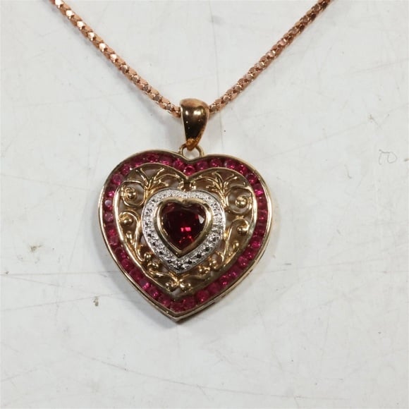 Sterl Silver pendant w/ Lg Ruby Center Stone & 36 Sm Rubies on .925 SS Chain