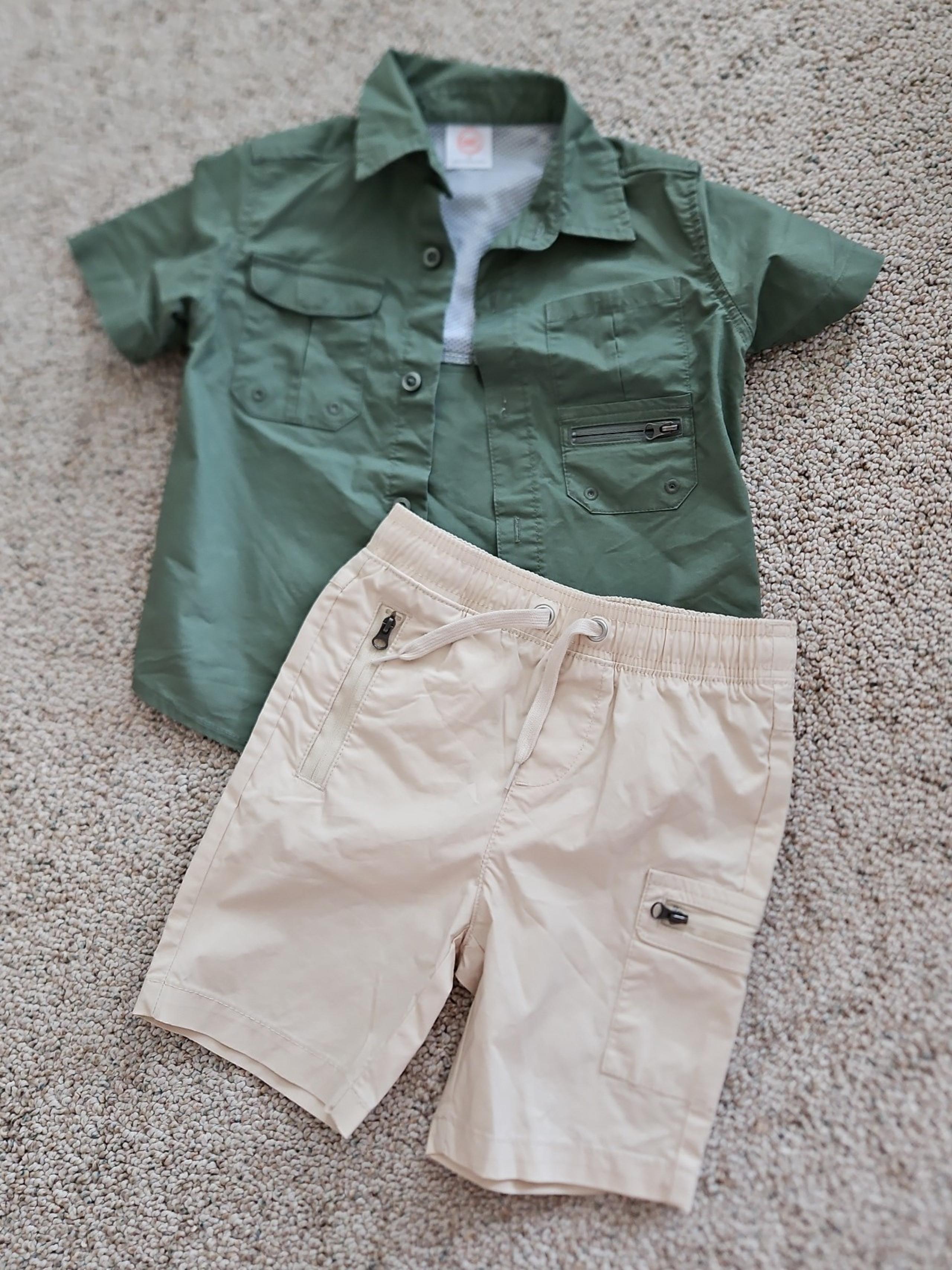 Tan boy's shorts and green shirt.