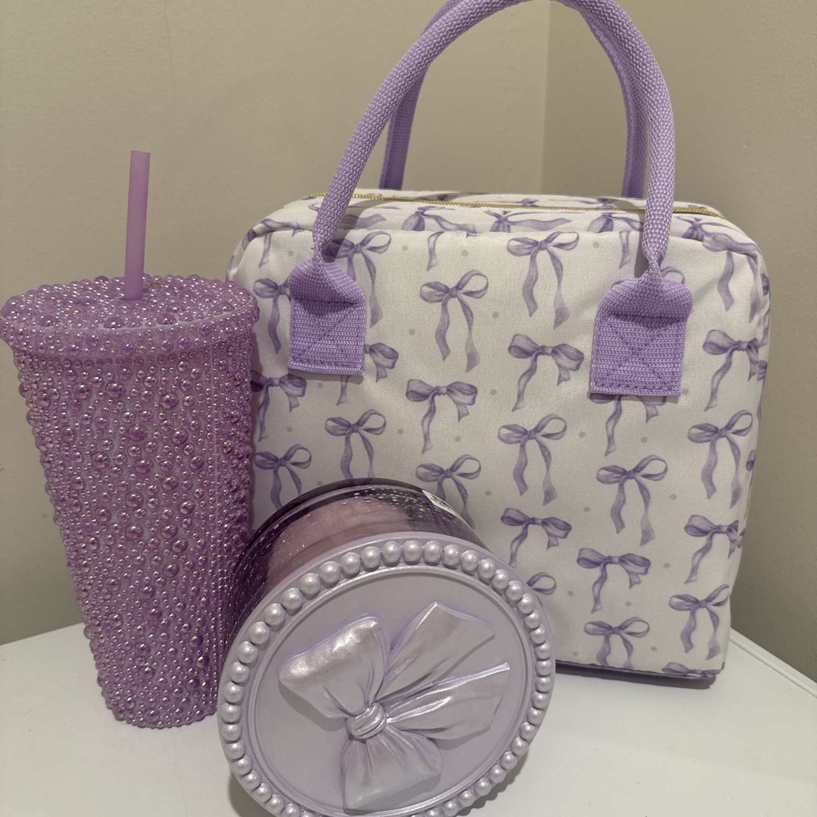 Purple/white Candle , bag, and cup