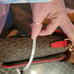 Michael Kors dark brown with red flap. Paid 104 original price 298.