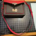 Michael Kors dark brown with red flap. Paid 104 original price 298.