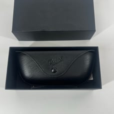 Persol sleek black leather sunglasses case includes box and cleaning cloth
