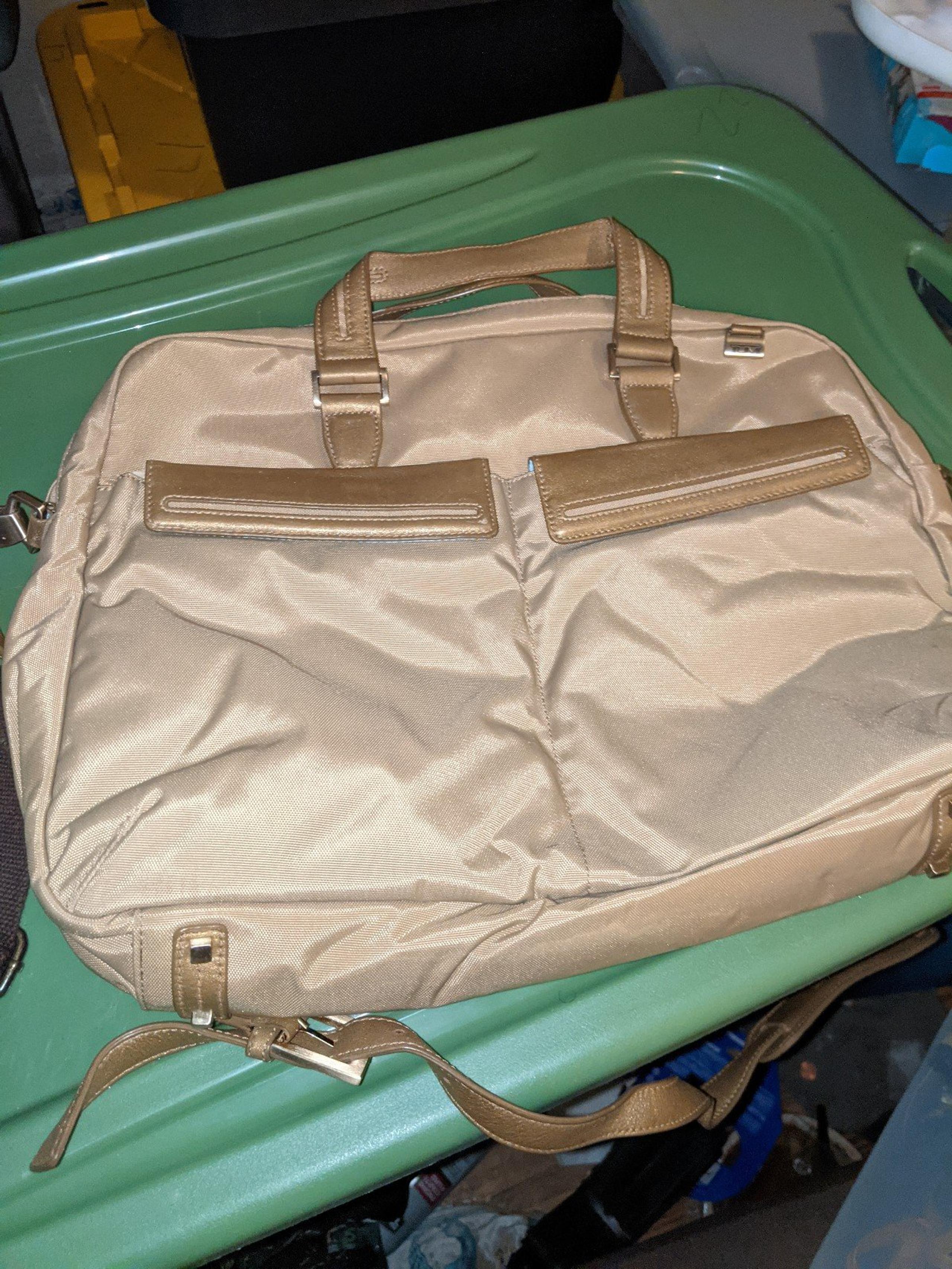 TUMI  (NEW) Brief TRAVEL Shoulder LAPTOP Organizer Bag classy gold NEW.