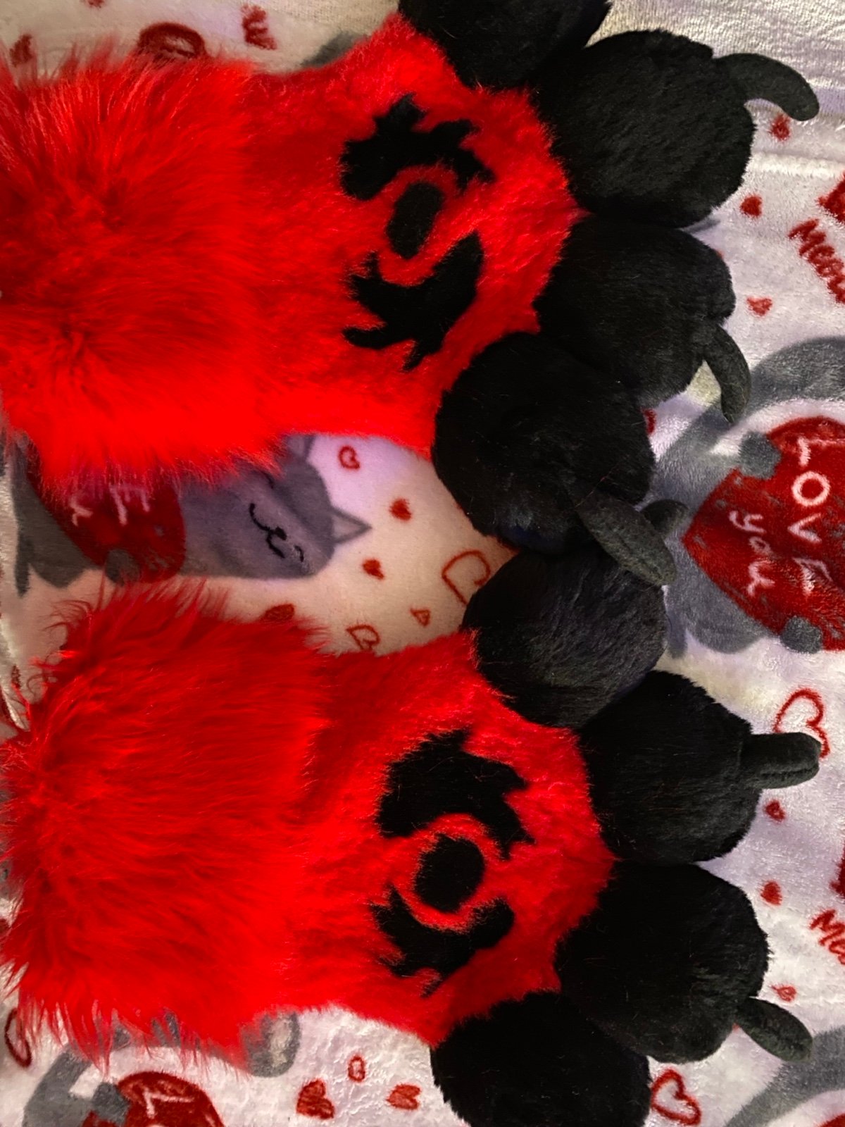 Red and black fursuit paws